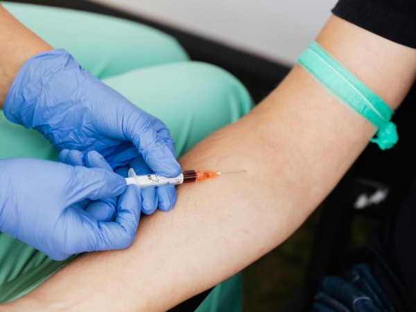 Pharmacist assisting customer at modern pharmacy counter